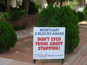 mortuary marathon sign: don't even think about stopping