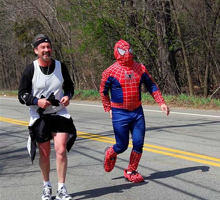 Man in spiderman costume pulls hamstring running